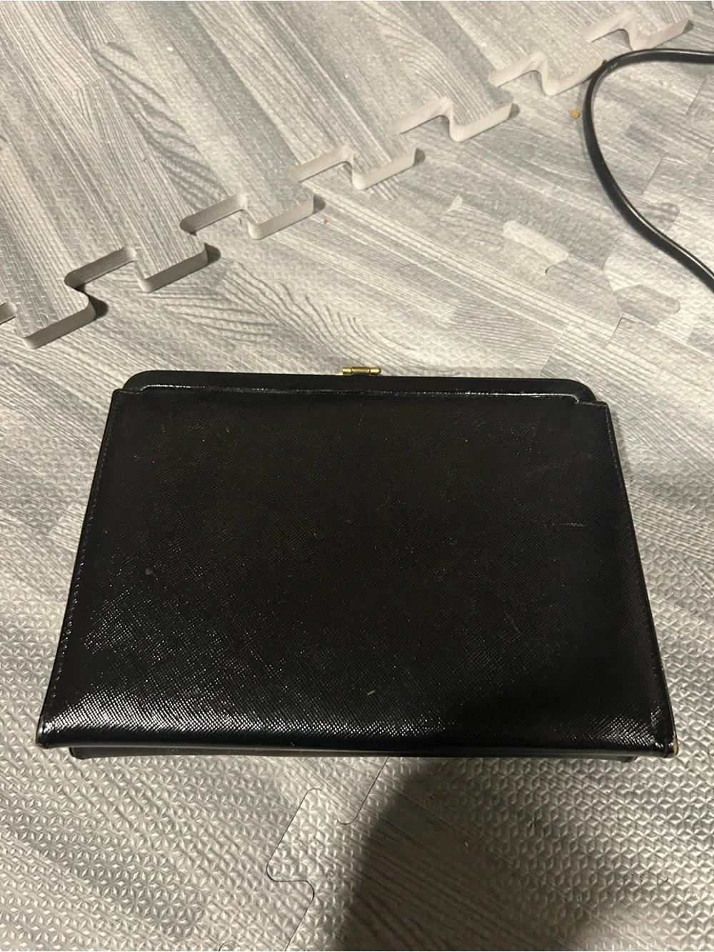 Elegant Black Evening Clutch with Decorative Gold Accent